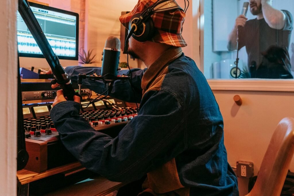 Person wearing Sony WH-1000XM6 headphones while working in a modern coffee shop
