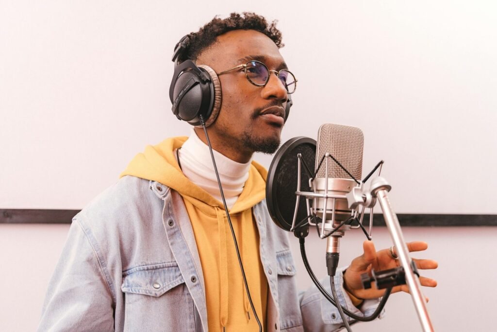 Person wearing Sennheiser HD 660S2 headphones in a home studio environment